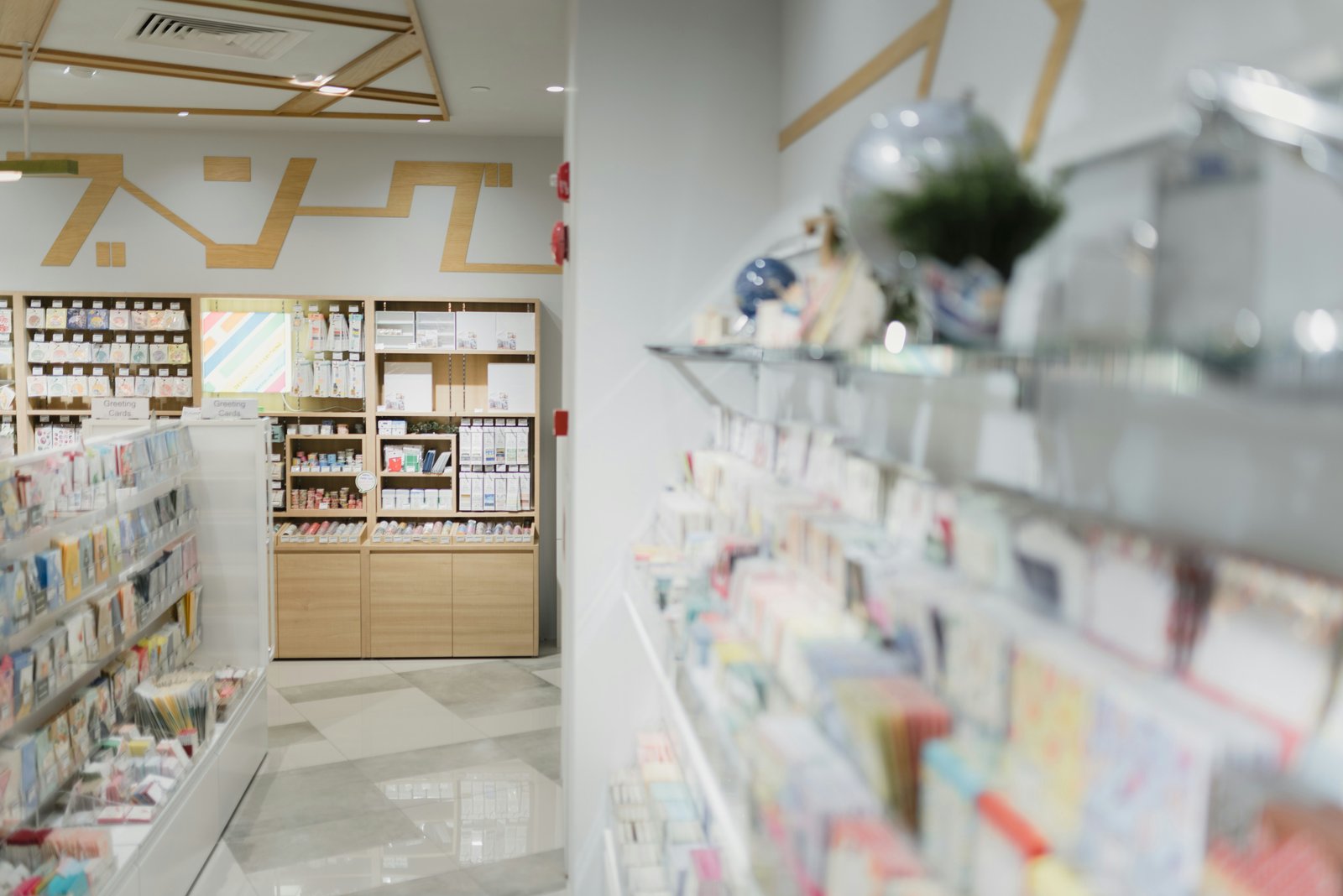 Brightly lit retail pharmacy shelving stocked with consumer health products